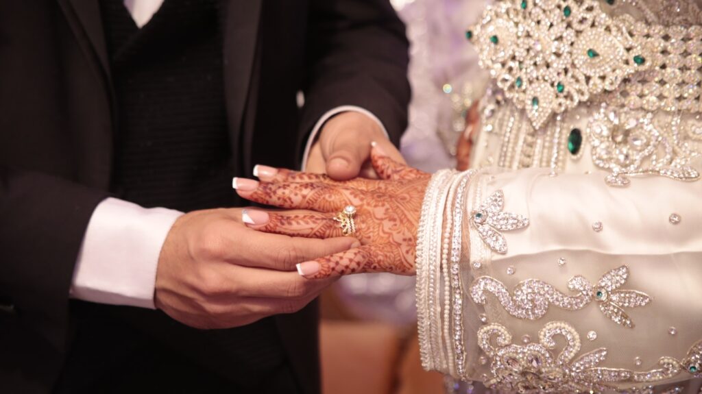 a close up of a person holding another person's hand