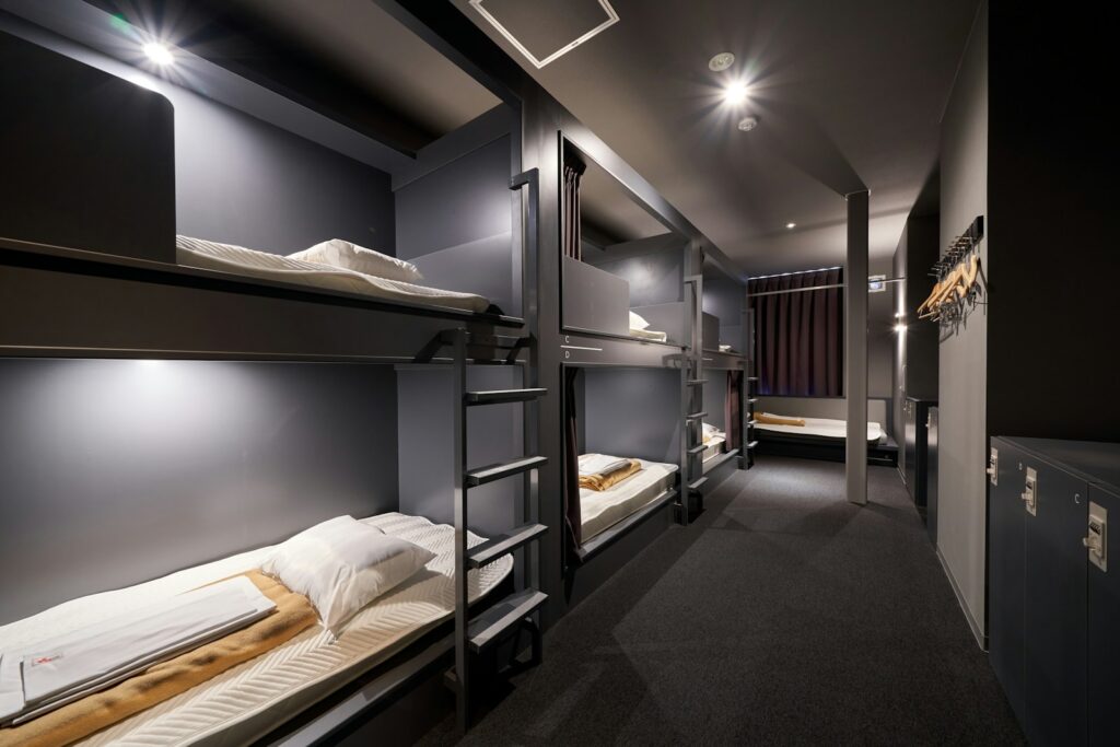 A long row of bunk beds in a room