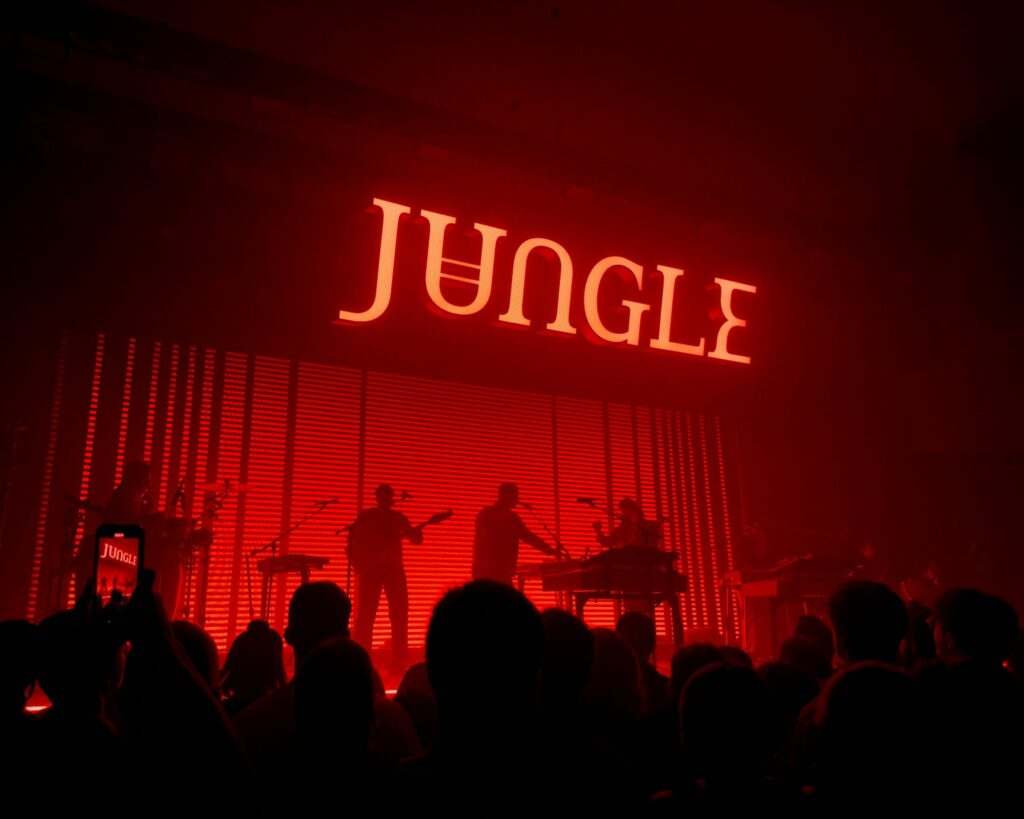 a group of people standing on top of a stage