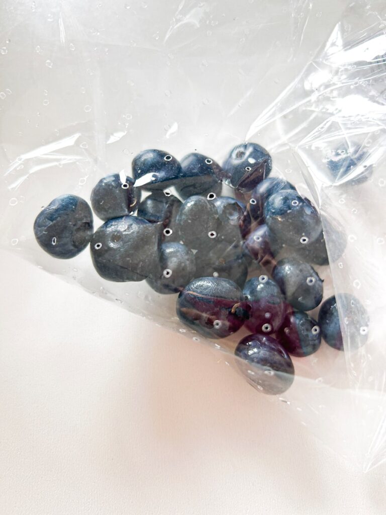 Blueberries are in a clear plastic bag.
