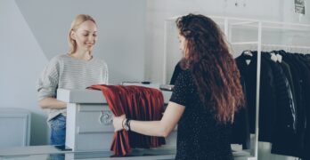 A customer exchanges an item at the counter.