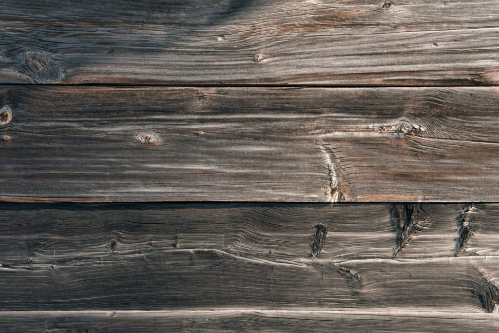 From above texture of aged shabby wooden table made of natural lumber panels as abstract background