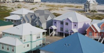 assorted-color houses near seashore