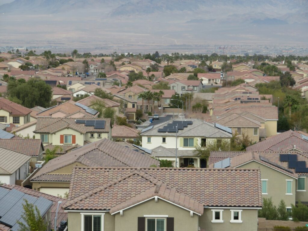 a lot of houses with a mountain in the background