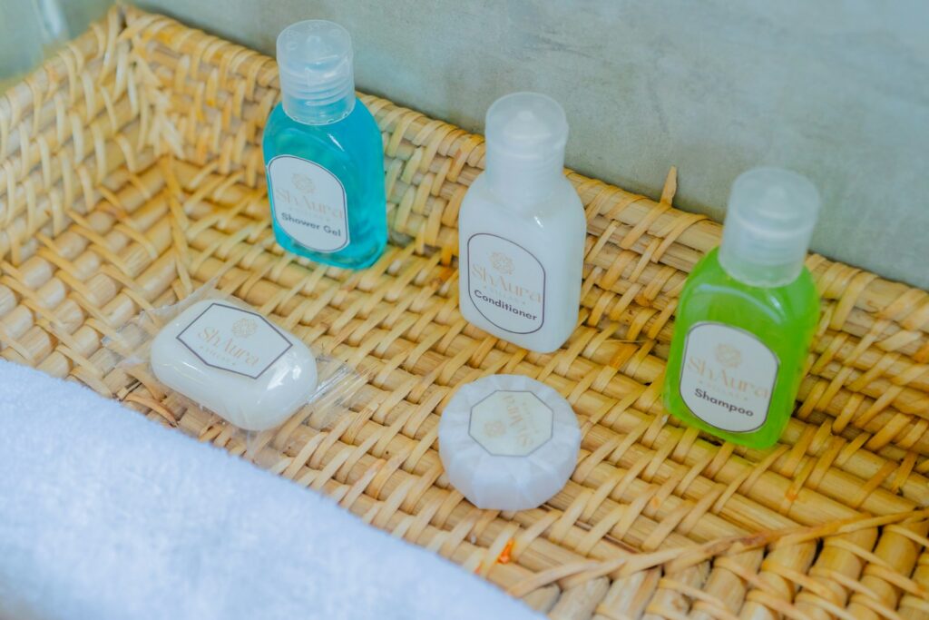 Bath products are neatly arranged in a woven basket.