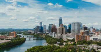 river near buildings during daytime