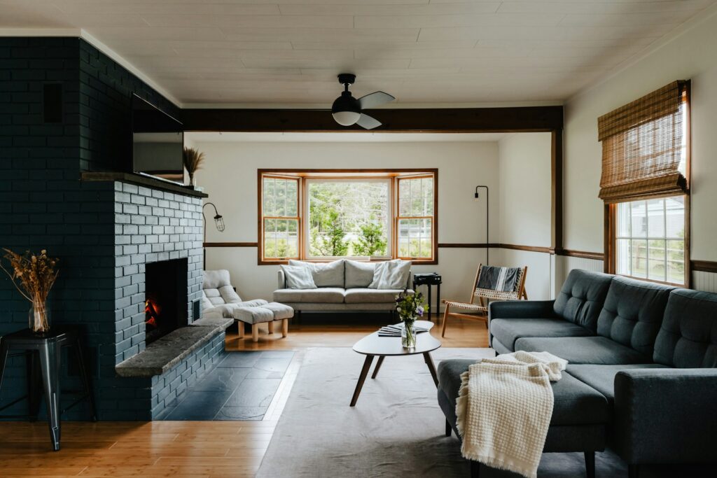 a living room filled with furniture and a fire place