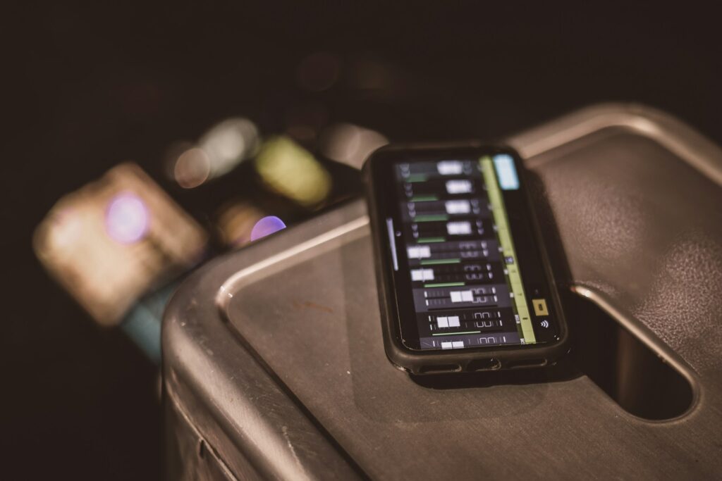 black smartphone on brown table