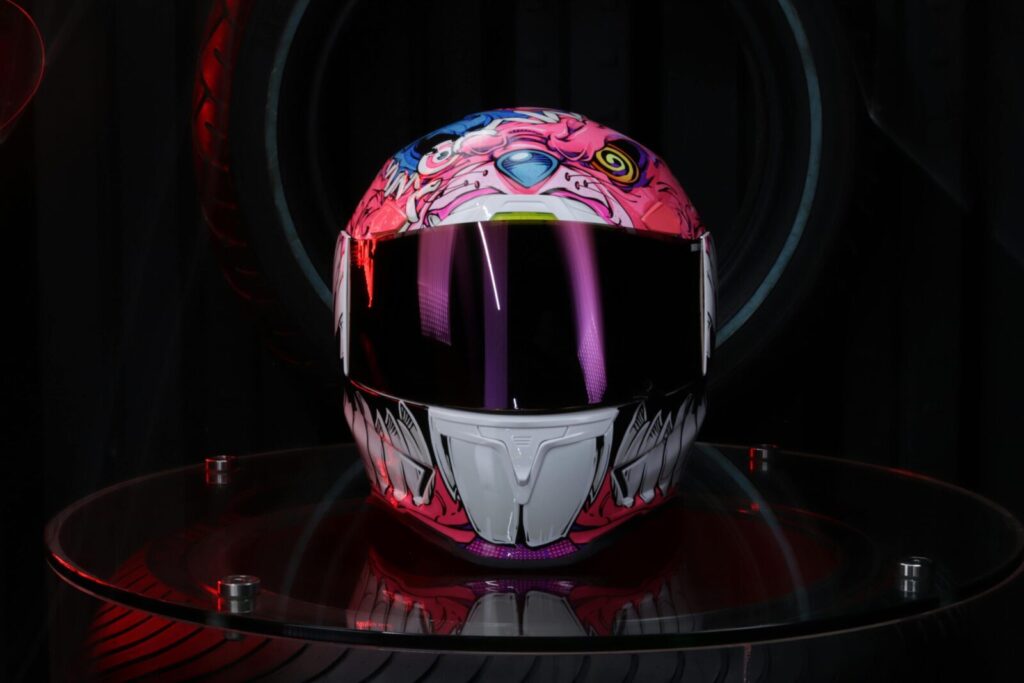Vibrant and artistic motorcycle helmet with colorful design and visor.
