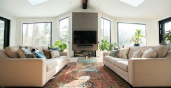 living room with white sofa and black flat screen tv