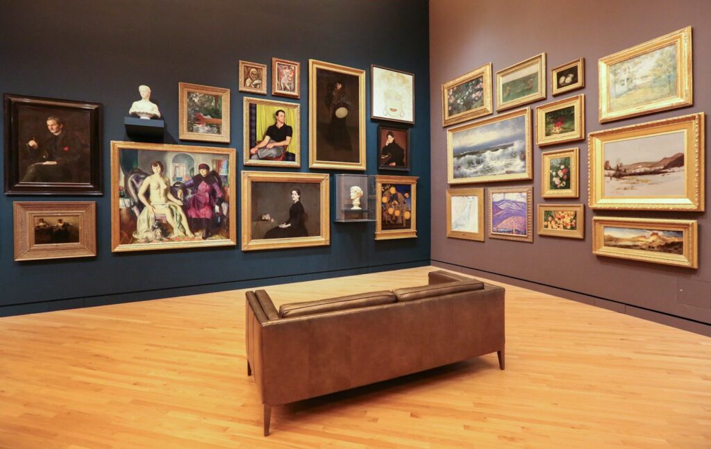 brown loveseat surrounded by photo frame lot