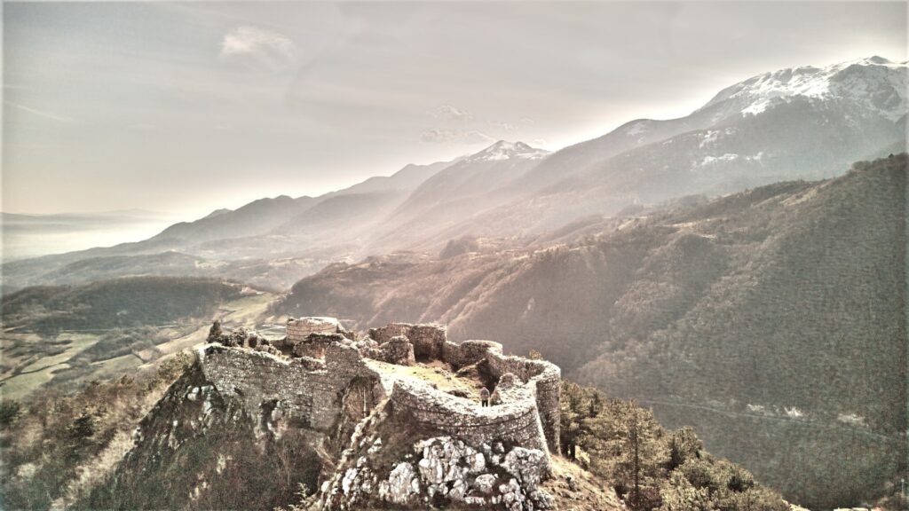 An old castle perched on a rocky mountain.