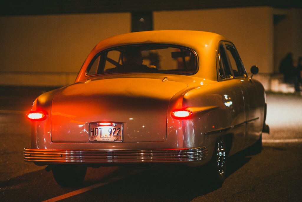 a yellow car parked on the side of the road