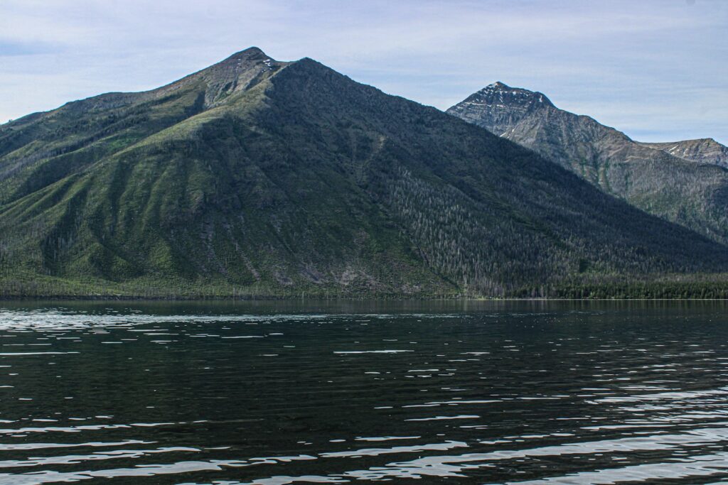 A large body of water with mountains in the background