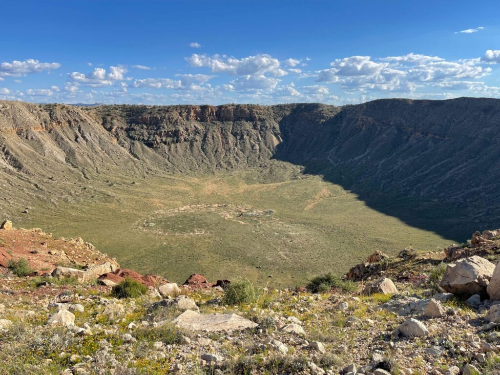 Stunning view of the Meteor Crater in Arizona under a vibrant blue sky.