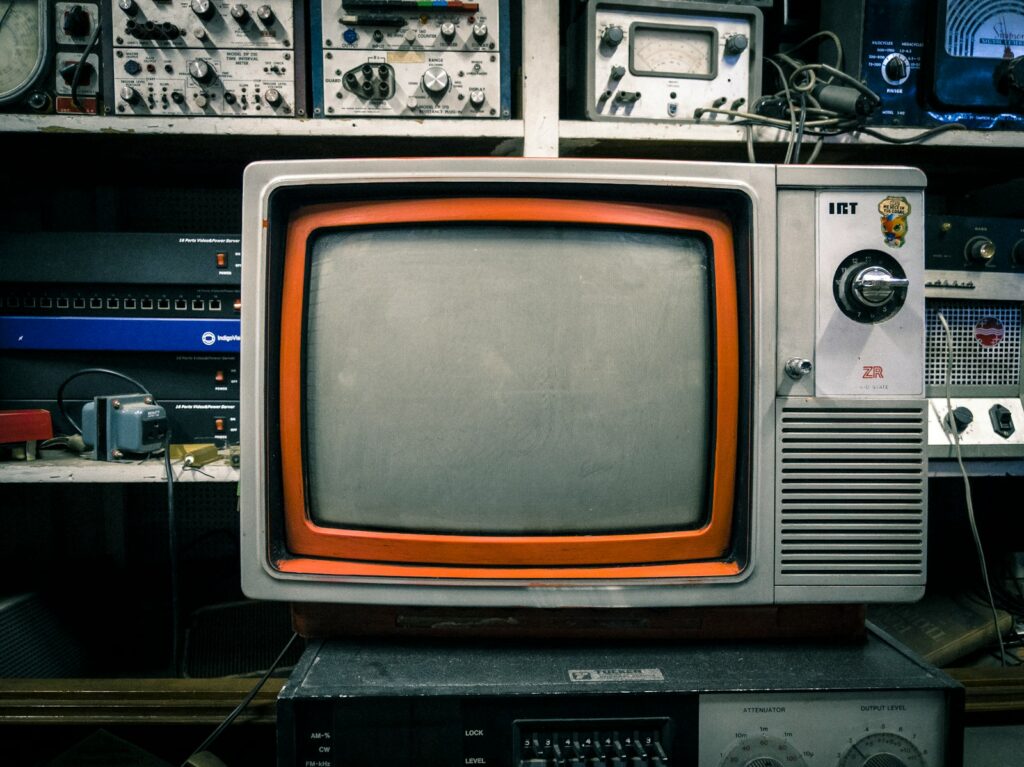 grey and orange CRT TV