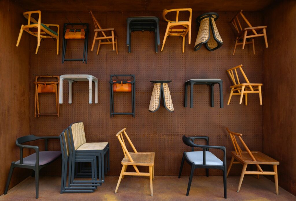 A room filled with lots of different types of chairs