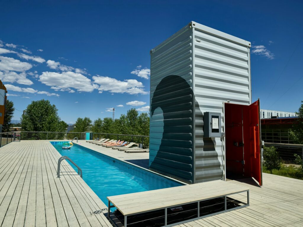 A swimming pool and supply building made of huge shipping containers in the “Taxi” district of the RiNo – a neighborhood of Denver, Colorado