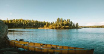 yellow canoe on body of water