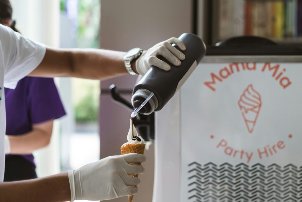 a person in white gloves is making a pastry