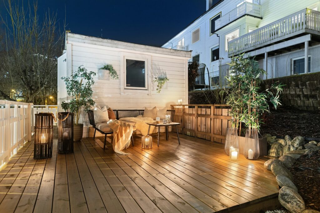 A wooden deck with a table and chairs