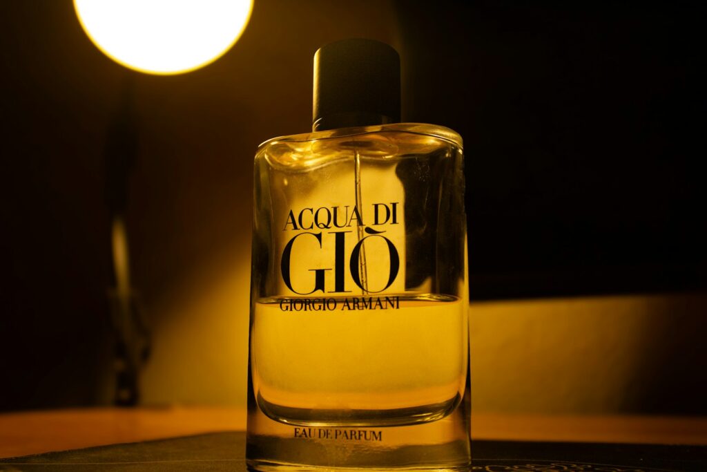 Acqua di gio perfume bottle with warm lighting
