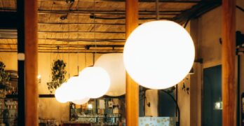a group of white lamps from a ceiling