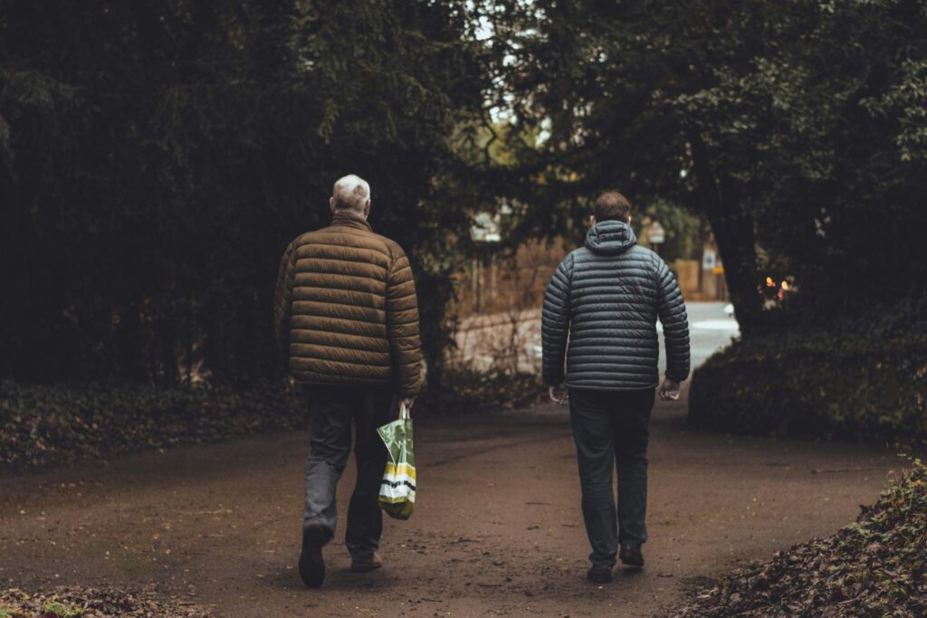 two men walking along the road