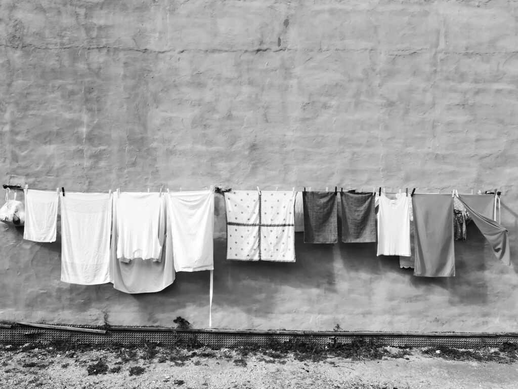 white textile hanging on wire