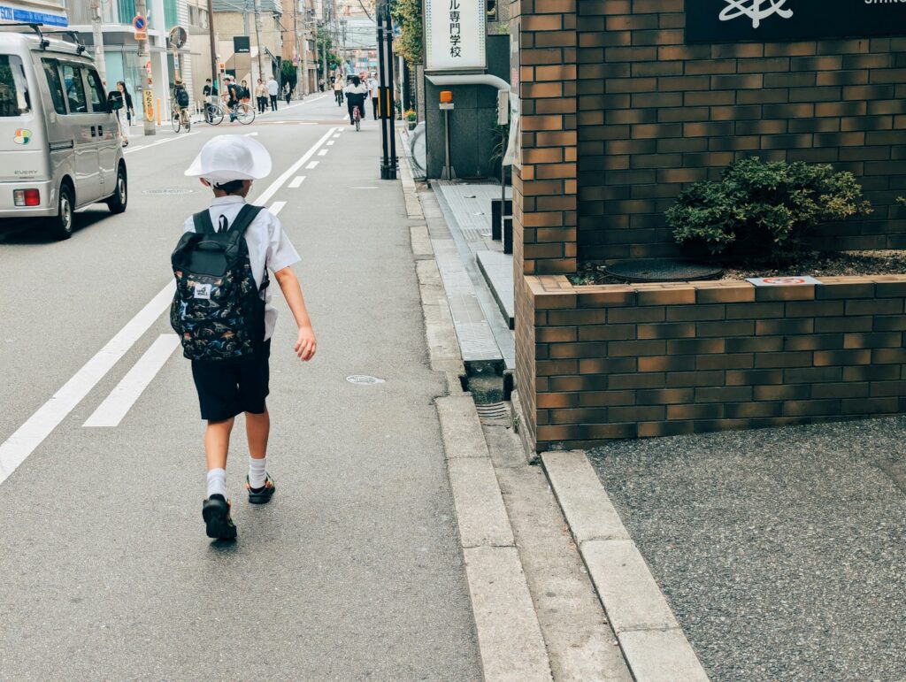 A person walking down a street with a backpack