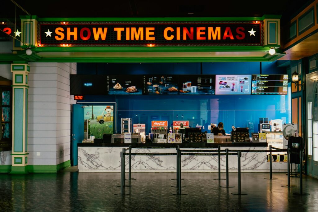The cinema has a bright "show time" sign.