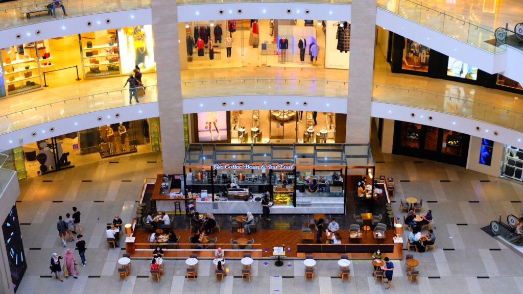 a mall filled with lots of people walking around